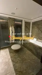 This video provides a comprehensive tour of The Chancery Rosewood, showcasing the luxury suites, the bathroom, the spa facilities, and the dining experiences. The creator uses a first-person perspective to guide the viewer through the hotel, highlighting the 'no checkout time' concept and the high-end interior design.