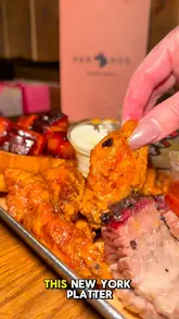 A fast-paced review of Red Dog Saloon, highlighting their BBQ platter, customisable burgers, and the live country music atmosphere.
