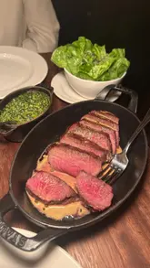 A promotional reel for Hawksmoor's 'Steak After Eight' menu, featuring a sequence of shots showing the restaurant's interior, cocktails, starters, and the main Chateaubriand steak with sides.