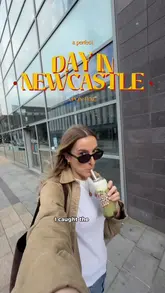 The video follows a creator on a day trip to Newcastle, documenting a series of stops including coffee shops, a brunch spot, a historic library, and a dinner venue. The content is presented as a 'day in the life' guide, highlighting the city's independent hospitality scene and local culture.