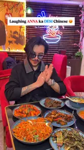 A high-energy vlog-style review of Wok & Spice in London, featuring the creator interacting with the chef and sampling a variety of Indo-Chinese dishes.