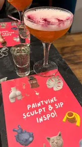 The video follows a creator and a friend attending a 'Sip & Sculpt' event hosted at a Slug & Lettuce venue. It captures the process of working with clay, enjoying cocktails, and the overall social atmosphere of the activity.
