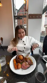 The creator visits The Whitehall in Leeds to review their Sunday roast. The video features a mix of talking-to-camera segments, shots of the menu, and close-ups of various dishes including prawns, focaccia, and three types of roast meat. The creator provides personal commentary on the food quality and mentions celebrating a birthday.