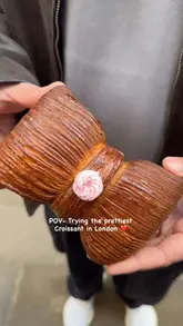 A short video showcasing a unique bow-shaped croissant from Sourdough Sophia in London. The video features close-up shots of the pastry's exterior and a cross-section reveal of the filling.