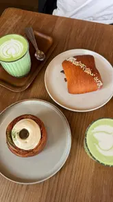 A short, punchy montage showcasing a brunch and bakery spot in London, featuring close-ups of pastries, a matcha latte, and various brunch plates.
