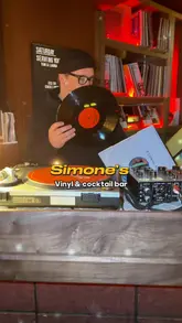 A stylish promotional video for Simone's, a vinyl and cocktail bar in Liverpool. The video features a montage of the venue's interior, focusing on the vinyl record player, the bar area, and a selection of signature cocktails, all set to a rhythmic soundtrack.