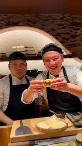 A high-quality montage showcasing the preparation and presentation of a 15-course omakase menu at Juno Omakase. The video focuses on the precision of the chefs and the artistic plating of the dishes, highlighting the fusion of Japanese and Mexican influences.