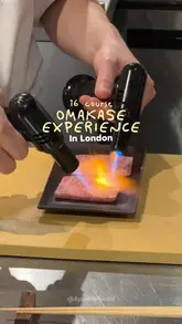 A fast-paced, visually appealing montage showcasing a 16-course omakase dining experience in London. The video focuses on the preparation of various sushi dishes, including torching techniques, and highlights the intimate counter-seating environment.