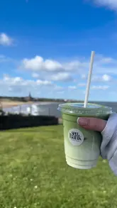 A short, engaging video showcasing 'Seabank,' a new cafe and ice cream shop located in Tynemouth. The video features shots of the nearby beach, the venue's exterior, the menu, and close-ups of the ice cream and matcha drinks being prepared and enjoyed.