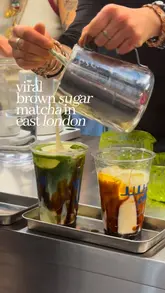A short, energetic review of a cafe in Hackney Wick that serves viral matcha drinks. The video highlights the preparation of the drinks and the unique setting of the cafe, which is located upstairs from a homeware store.