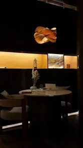 A visually stunning, slow-paced montage of a fine dining Japanese restaurant, MATER1A. The video highlights the intricate plating of a tasting menu, including dishes like madai with ikura and prawn, chawanmushi, and tuna with leek and elderflower. It captures the intimate, low-lit atmosphere of the 16-seat venue.