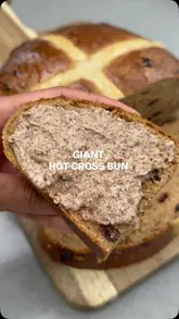 A home cooking tutorial demonstrating how to make a giant hot cross bun and a pecan maple brown butter. The creator walks through the steps, including making the tangzhong, kneading the dough, and preparing the compound butter.