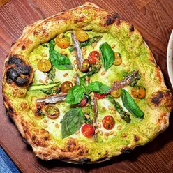 Paid a visit to Marco at his 9-month-old pizzeria in London 🇬🇧

Spot those artistic pizza paintings on the wall 😂🤌

I know Marco’s dough game is master level. But I’ve always wondered — how does that translate when you’re doing it at commercial scale? More pies, less attention, same quality? 🤔 

Then I watched our pizzas pop out of his oven 😮 Glorious leopard spotting! Insane puffiness! Every concern vanished!! 

This first pizza I picked for its fresh spring vibes — homemade asparagus cream sauce, tender asparagus heads, Buffalo Mozzarella D.O.P., Cetara anchovies, toasted pine nuts, marinated yellow and red cherry tomatoes, and 100% Italian extra virgin olive oil.

From dough to topping — just perfetto. I devoured it and wiped the plate clean in minutes 💯👌👌

Second pizza in my next post!

#pizzaHunter #GourmetPizza #LondonEats #AsparagusPizza #canotto

===== watch our full experience on youtube =====