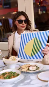 A stylish, aesthetic reel featuring a creator dining at Jamie's Italian in Leicester Square. The video showcases various dishes including pizza, pasta, fries, and burrata, interspersed with shots of the creator enjoying the meal.
