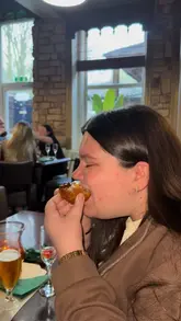 A short, energetic reel documenting a visit to 'Twenty 26' at Crocket's Hotel. The video features a montage of the menu, drinks, live music, and various dishes including tempura prawns, chicken skewers, a scotch egg, and fish and chips, capturing the overall dining experience.