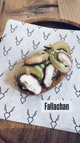 A montage showcasing a 7-course spring tasting menu at Fallachan Kitchen, featuring close-ups of dishes like langoustine broth, white asparagus, and John Dory, alongside shots of the kitchen and the menu.