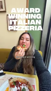 A promotional video featuring a visit to Berberè Pizzeria in Westfield Stratford City. The creator highlights the sourdough pizza, the preparation process, and a 2-for-1 offer. The video includes shots of the interior, the chef preparing dough and toppings, and the creator tasting the food.