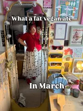 A personal mirror selfie used as a cover image for a 'what I ate' vlog, featuring a casual, cluttered bedroom setting.