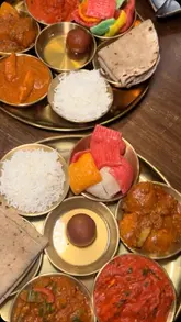A short, energetic review of The Bewicke Arms, highlighting its cozy pub atmosphere and Indian cuisine. The video features quick cuts of the exterior, interior, and various dishes including a thali, chicken, and desserts, accompanied by a voiceover sharing a positive experience.