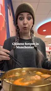 The creator visits a Chinese hotpot restaurant in Manchester, demonstrating the self-service process of selecting ingredients, weighing the bowl, preparing a custom sauce, and enjoying the meal. The video highlights the variety of ingredients available, including seafood and meat options, and mentions the availability of halal choices.