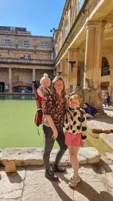 A family-oriented vlog documenting a budget-friendly day out in Bath, featuring visits to a toy shop, the Roman Baths, a local park, and a stop at McDonald's.