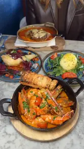 A fast-paced, engaging review of an Italian restaurant in Soho, London, showcasing fresh pasta preparation, signature dishes like bone marrow spaghetti and pistachio tiramisu, and the overall dining experience.