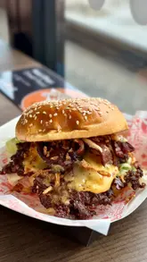 A montage video showcasing the various food and drink vendors at Platform Street Food in Cardiff Bay, featuring shots of burgers, pasta, pizza, desserts, and cocktails, alongside interior and exterior venue shots.