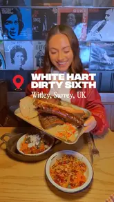 A vibrant video review of The White Hart in Witley, Surrey, highlighting the Dirty Sixth BBQ residency. The video features a tour of the pub's interior, close-ups of smoked meats, Asian-fusion sides, and American-style desserts, presented with an enthusiastic voiceover.