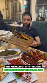 A review of a Kerala restaurant in East London, highlighting their table-side theatrics and a variety of dishes including a mixed grill, bamboo beef curry, and prawns.