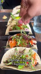 A short, energetic video showcasing the food and interior of Cheeky Chicos in Clapham. The reel features close-up shots of tacos, nachos, and spicy margaritas, along with glimpses of the restaurant's colourful decor and the food preparation process.