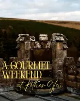 A high-quality, atmospheric shot of a stone castle turret against a moody Scottish landscape, used to promote a 'Gourmet Weekend' at Rothes Glen.