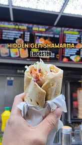 A short, informative review of Al Aqsa Shawarma in Leicester, focusing on their Kurdish-style shawarma. The video highlights the preparation process, including the use of a tandoor oven, and provides a personal recommendation based on long-term patronage.