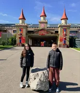 A photo of two children standing in front of the entrance to Gulliver's Valley theme park.