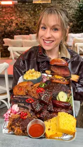 A couple visits 'The Nook' in Dover, a brunch cafe that transforms into a smokehouse at night, to review their 'Ultimate Pitmaster' meat platter.