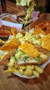 A montage-style video showcasing the various food and drink vendors at Platform Street Food in Cardiff Bay. The video features close-ups of burgers, pizza, loaded fries, cocktails, and gelato, alongside shots of the venue's interior and outdoor seating area.