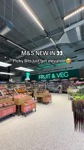 A short, energetic video showcasing new picnic-themed accessories at an M&S Food store, specifically highlighting a fold-away picnic rug and a wine cooler bag.