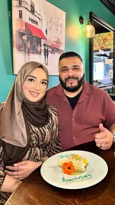 The creator visits Tarragon Bistro in Birmingham for an anniversary meal with his wife and son. The video follows a vlog format, showing the exterior, interior, menu, and various dishes including ribeye steak, duck roast, and cheesecake. The creator provides commentary on the food quality and service, creating a personal and welcoming impression of the venue.