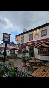 A montage-style tour of The Old Horse pub, featuring exterior shots, the interior bar area, the pizza preparation process, and the outdoor beer garden.