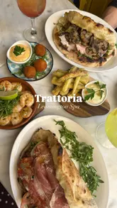 A promotional montage video for a Trattoria restaurant, featuring shots of the interior, menu, cocktails, and various Italian tapas and panuozzi dishes.