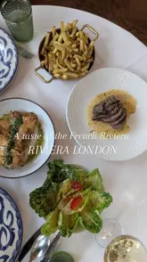A montage of high-quality, slow-paced shots featuring various dishes and the elegant interior of Riviera London. The video focuses on the aesthetic presentation of the food and the sophisticated atmosphere of the dining room.