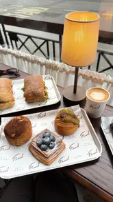 A short, engaging reel showcasing a variety of pastries and sandwiches at Fred Bakery. The video features close-up shots of the food, including a tiramisu croissant, and brief glimpses of the bakery's interior, set to music with text overlays.