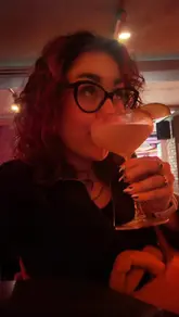 A creator takes viewers on a 'day in the life' food and drink tour across Manchester, visiting a coffee shop, a pub, a pizza spot, a cocktail bar, and a food hall. The video features quick cuts, on-camera commentary, and close-ups of the food and drinks at each location.