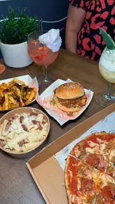 A vlog-style review of 'Platform Street Food' in Cardiff Bay, showcasing the ordering process, the venue's interior, and a variety of dishes from different vendors including burgers, pizza, pasta, and ice cream.