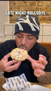 A vlog-style review of 'Late Night Roll Boys' in London, highlighting their Thursday late-night opening hours. The video features the creators visiting the venue, showing the queue, the DJ, the drink selection, and the indulgent cinnamon rolls.