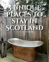 A promotional image for a travel listicle featuring a unique outdoor copper bathtub in a rustic Scottish setting. The image uses natural, soft lighting to highlight the texture of the tub and the surrounding wooden structure, creating an inviting and aspirational atmosphere for a getaway.