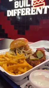 A short montage showcasing the menu and ordering process at Boo, a halal burger restaurant. The video highlights their breakfast deal and a 'munchbox' combo featuring a smash burger, fries, and chicken tenders.