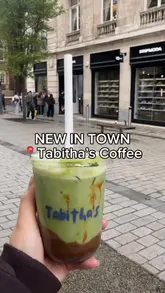 A short, energetic reel showcasing Tabitha's Coffee, located inside the Dripmoda retail store in Liverpool. The video features quick cuts of the exterior queue, the interior coffee-making process, and a final shot of a matcha drink.