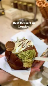 A short, engaging video showcasing the preparation and consumption of a Sicilian brioche bun filled with Italian gelato at Bilmonte in Soho. The video highlights the menu, the fresh preparation process, and the creator's positive reaction to the dessert.