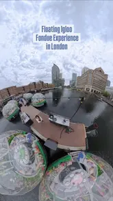The video features a unique floating igloo dining experience in Canary Wharf, London, provided by Skuna Boats. It utilizes 360-degree camera footage to capture the igloos on the water, the surrounding city views, and the fondue dining experience inside. The edit is smooth and engaging, highlighting the novelty of the activity.