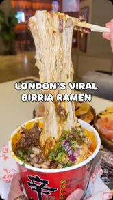 A short-form video review of Fuego 1987, a Mexican food stall located within the Tower Bridge food hall. The video features close-up shots of their viral birria ramen, tacos, and nachos, with a voiceover providing a positive review of the food quality and experience.